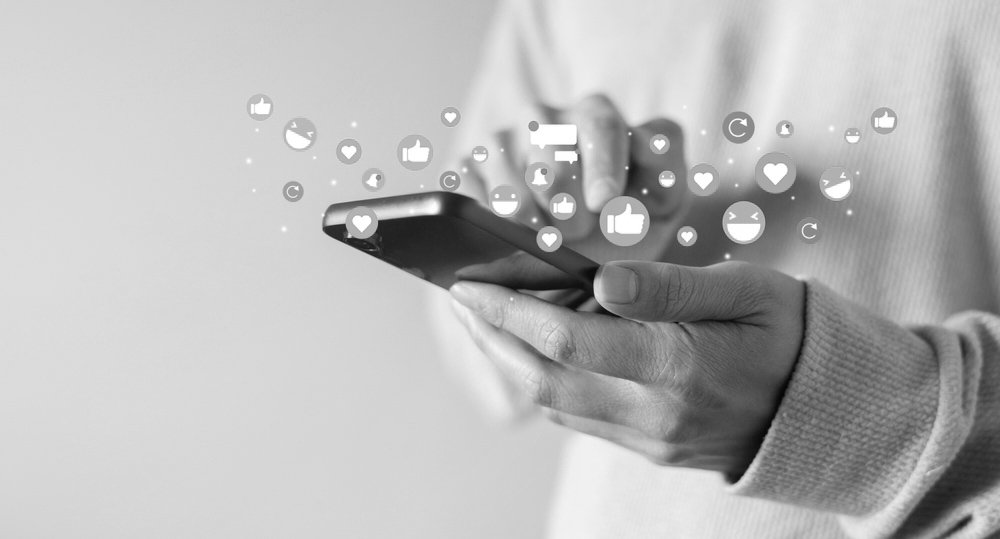Adult,Man,Hand,Hold,Smartphone,And,Use,Social,Media ... adult man hand hold smartphone and use social media network application to check new feedback or interactive with people or friend by reply chat or send emoticon for react feeling and moment concept